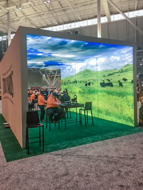 SEG lightbox freestanding archway with seating and double-sided graphics and turf